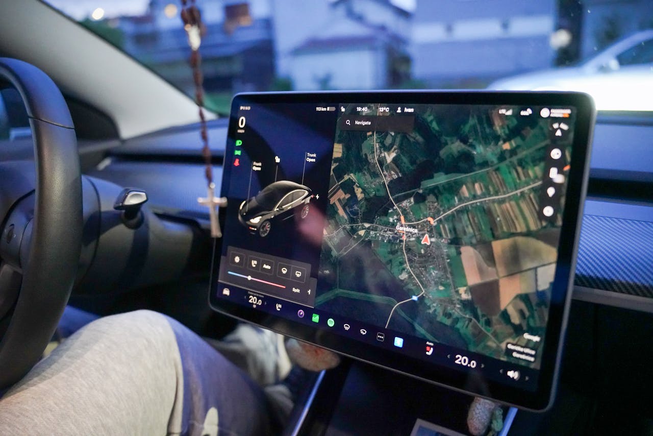 Close-up of a car's digital dashboard displaying GPS navigation in Garešnica, Croatia.